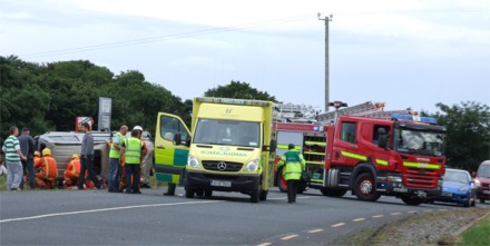 An ambulance arrives at the scene of the single vehicle crash.