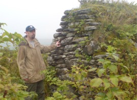 Moville tour guide Martin Hopkins at the overgrown Cooly monastic site.