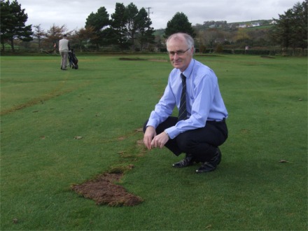 Billy McCaul inspects the damage to the fairway on the first hole at Greencastle Golf Club.