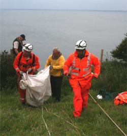 Make his day...Members of Greencastle Coast Guard who winched sturdy Harry to safety in a tarpaulin bag. 