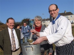 Local chef Brian McDermott pours out soup for Cllr. Martin Farren and Mary McKinney.