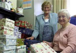 Maura Cannon, left, and Annette Faulkner co-ordinate the Christmas Shoe Box Appeal at Serenity House.