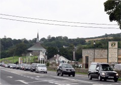 The funeral cortage of Isabel Taylor on its way from Burt chapel to the cemetery.