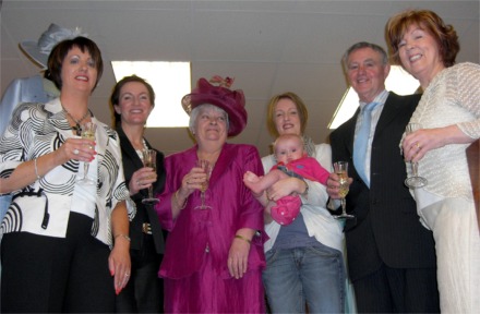 Bridie, centre, gets a helping hand from Topline staff, Roisin Doherty, Deborah Doherty and owners Charlie and Tina McDaid. Also pictured are Karen Breslin with baby Daile.