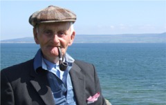 Havlin a nice day...Redcastle's Neil Havlin, 91, enjoys the sun at Bath Green, Moville.