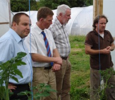 Padraig Fahy of Beechlawn Organic Farm Producers, Galway, showing Cllr Padraig MacLochlainn, Cllr Dermot Connolly and Deputy Martin Ferris around his produce.