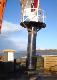 The lighthouse being taken away from Buncrana pier.