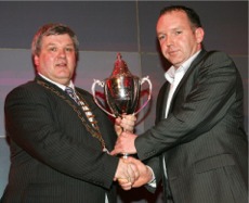 Gerry Crawford Mayor of Donegal presenting the best secondary school award to Paddy Carr of Scoil Mhuire, Buncrana.